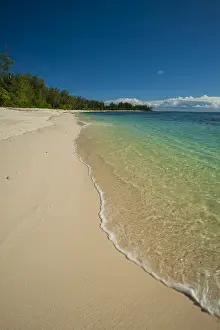 African Island Getaway Drucke: Water surging gently onto a pristine